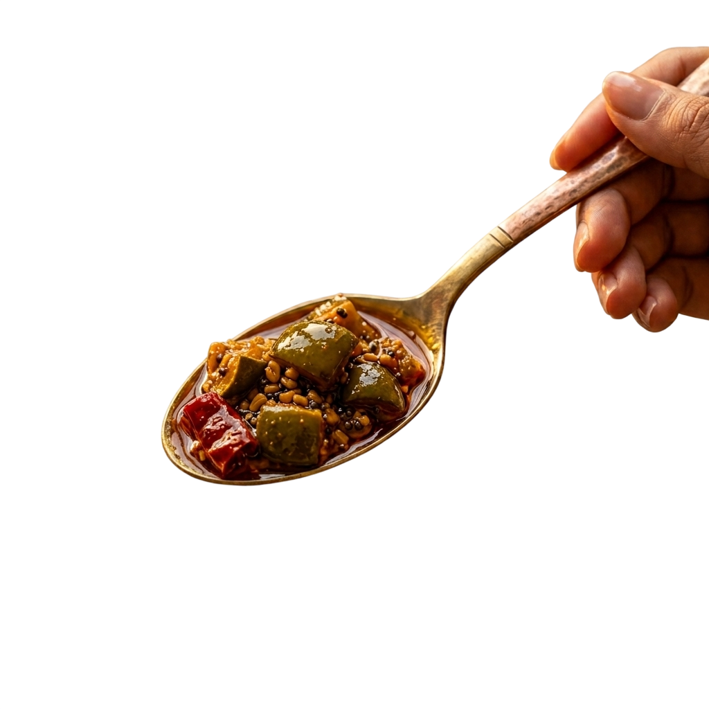 A spoon of Pacharika pickle being served